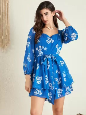 Berrylush Women Blue & White Floral Printed Sweetheart Neck Puff Sleeves Tie-Up Waist Layered Mini Jumpsuit